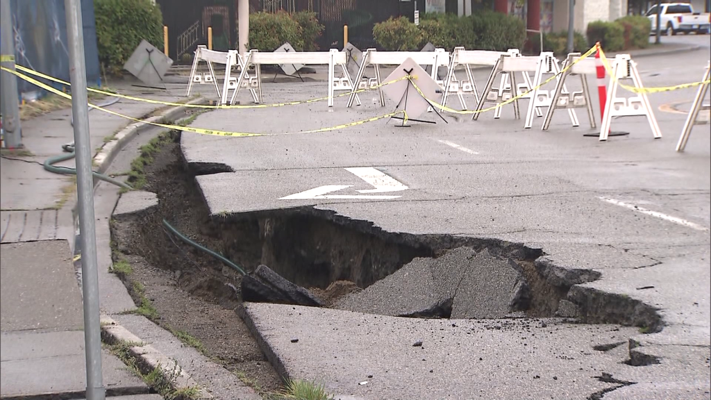 Mounties say they partially closed a section of Fraser Highway in Langley Saturday morning due to a sinkhole.