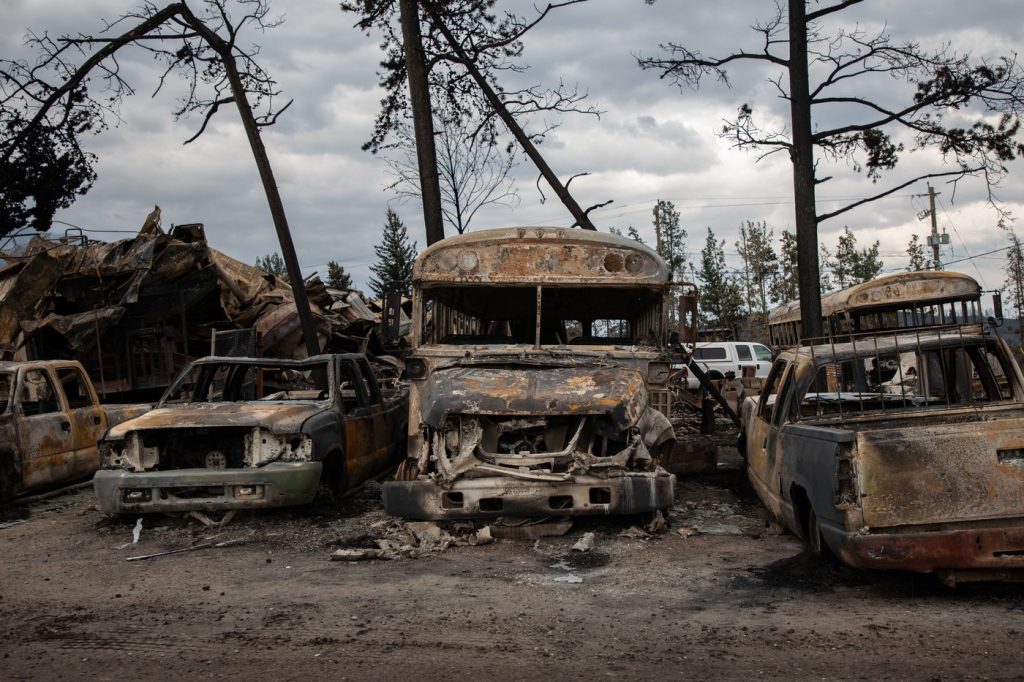 Burnt buses and cars in Jasper, Alta., on July 26, 2024. Human -caused climate change is making heat waves much more likely, the federal government says as 474 fires blaze across the country. That's according to Environment and Climate Change Canada's rapid extreme weather event attribution system, which compares today's climate to a pre-industrial one