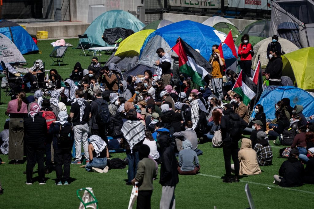 People gather and pitch tents at a pro-Palestinian encampment at the University of British Columbia campus in Vancouver on April. 29