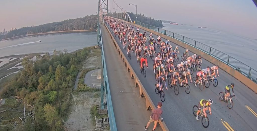 Cyclist ride across the Lions Gate Bridge in 2024's RBC GranFondo race.