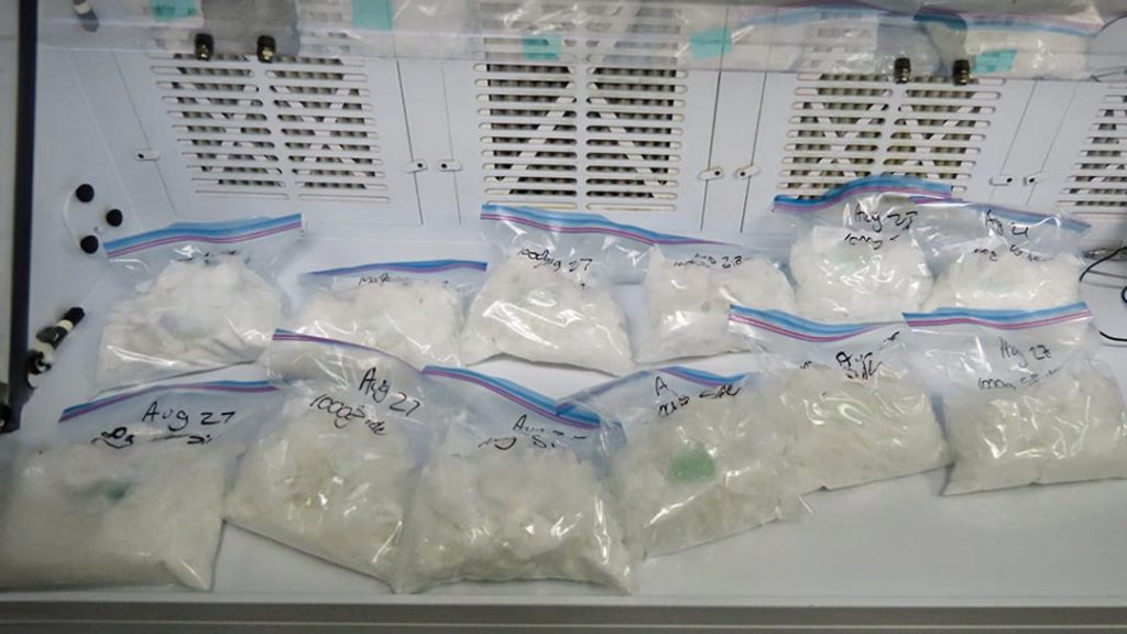 A table laden with seized illicit drugs