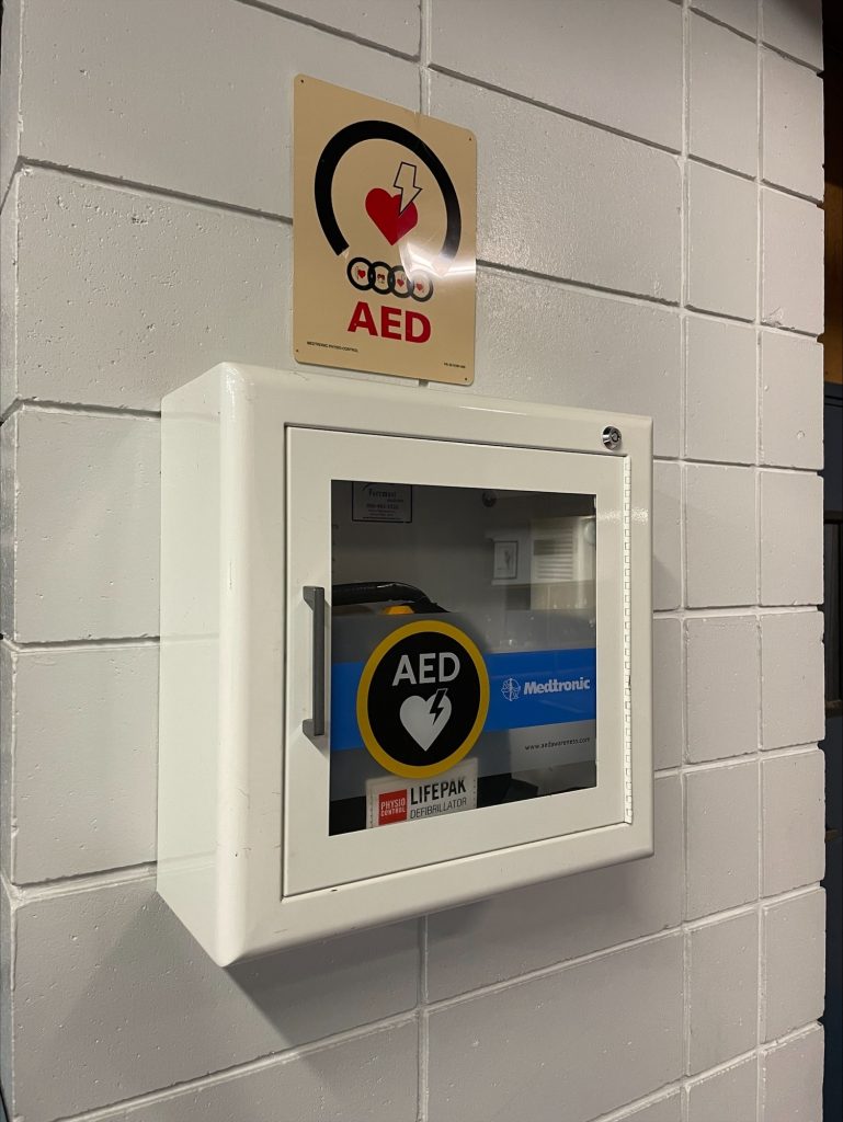 A wall container for an AED