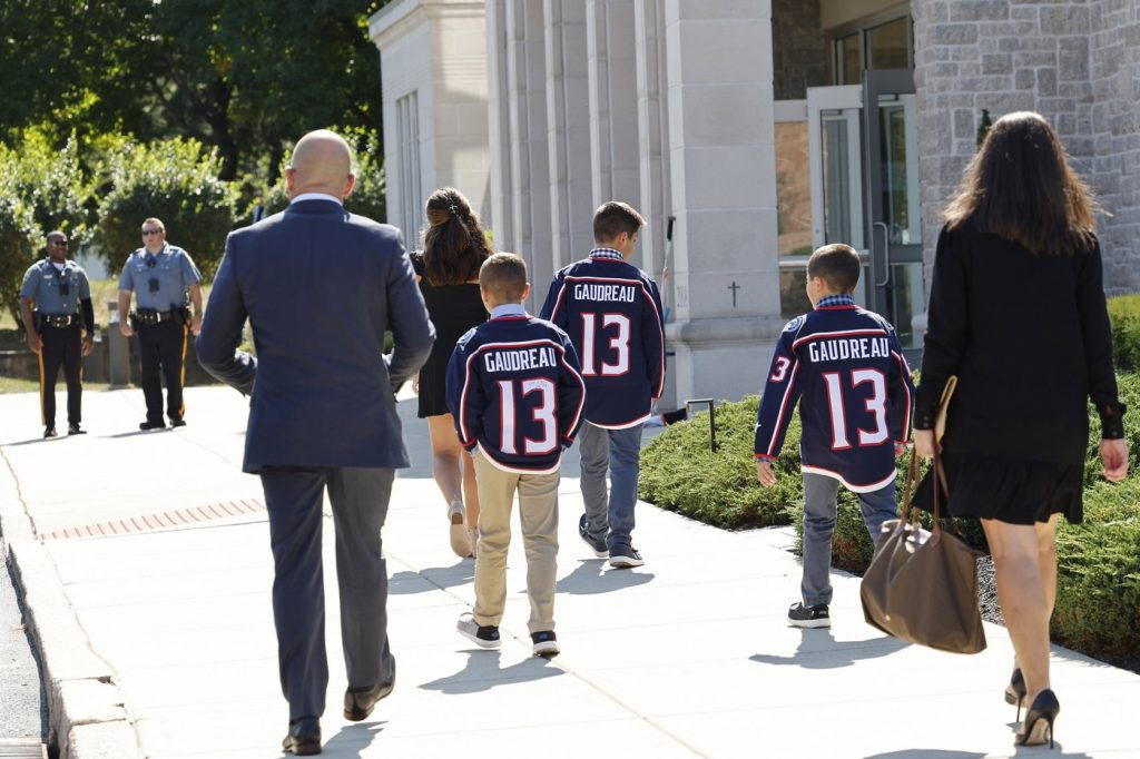 Young attendees wear Johnny Gaudreau's Columbus Blue Jackets jersey to the funeral services for Johnny Gaudreau and Matthew Gaudreau at Saint Mary Magdalen Church in Media, Pa., Monday, Sept. 9, 2024. (Yong Kim/The Philadelphia Inquirer via AP)