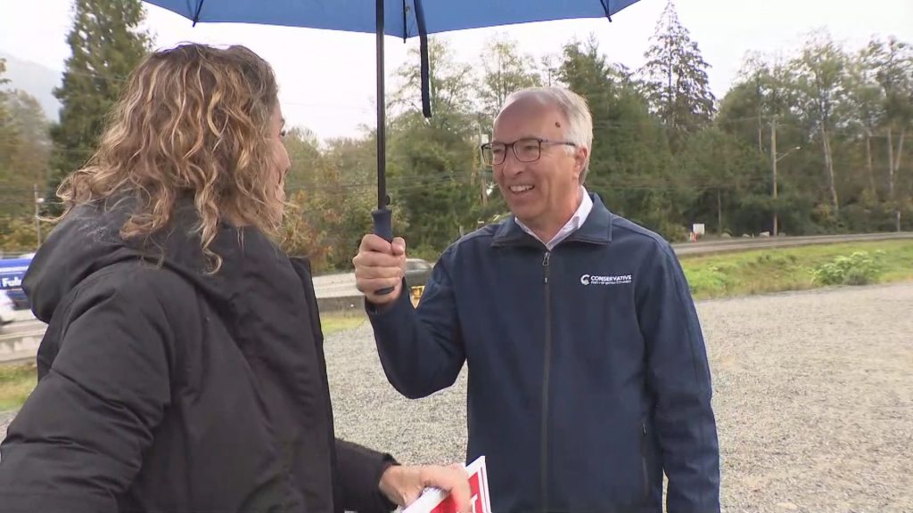 Conservative Party of BC Leader John Rustad speaks with a voter in Brackendale,