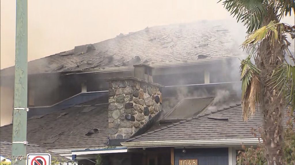 Vancouver Fire Rescue Services says a large house fire in Vancouver's Oakridge neighbourhood is under investigation on Monday, September 30, 2024. (CityNews Image)