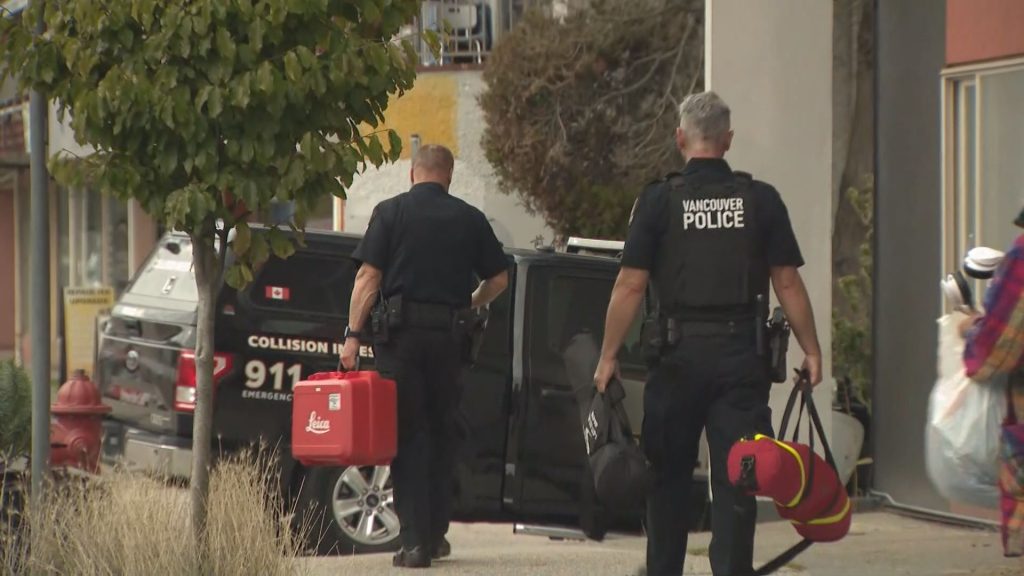 Vancouver Police stationed outside a building near Kingsway and Melbourne Street on Thursday October 3, 2024. (CityNews Image)