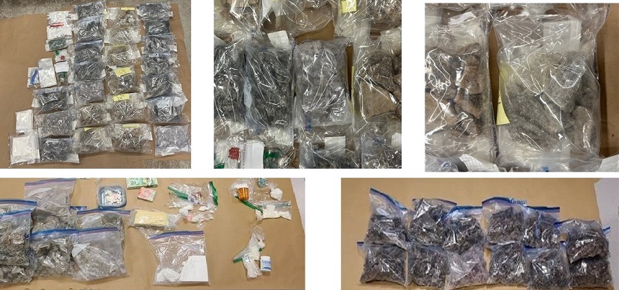 Tables laden with bags of illicit drugs