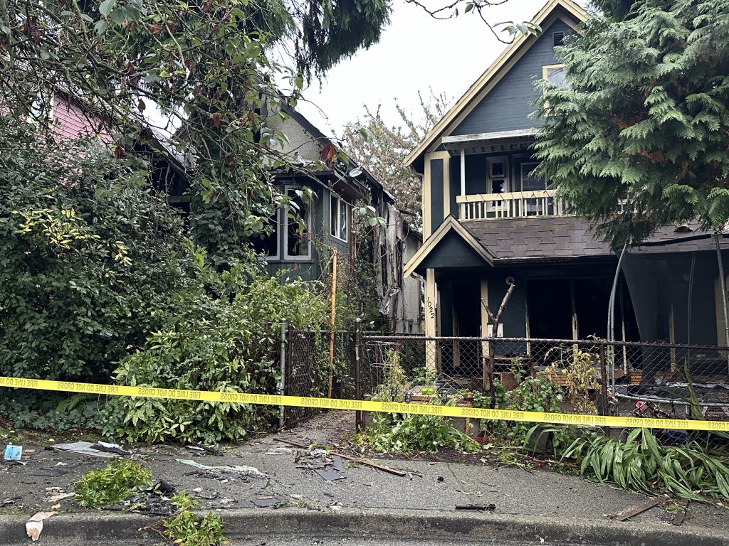 Two homes were likely destroyed in a massive East Vancouver fire Monday night. The blaze engulfed much of four houses on one street, with the charred remains seen on Tuesday, Oct. 8., morning. (CityNews Image / Monika Gul)