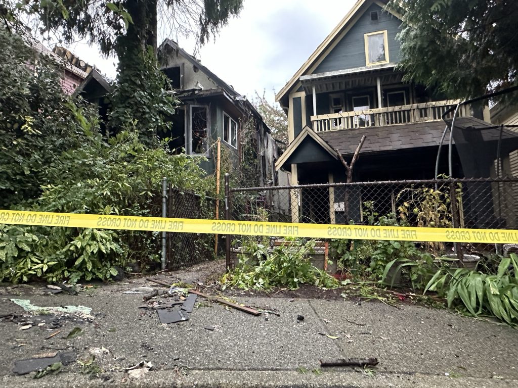 Two homes were likely destroyed in a massive East Vancouver fire Monday night. The blaze engulfed much of four houses on one street, with the charred remains seen on Tuesday, Oct. 8., morning. (CityNews Image / Monika Gul)