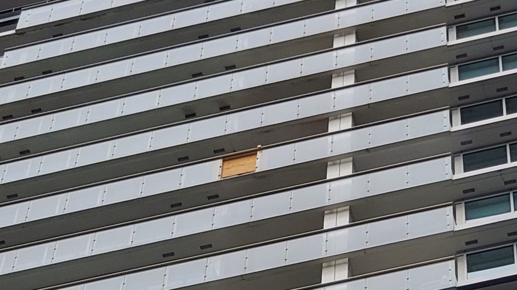 The space where a window had fallen out of a building is visible. (David Nadalini/1130 NewsRadio Image)