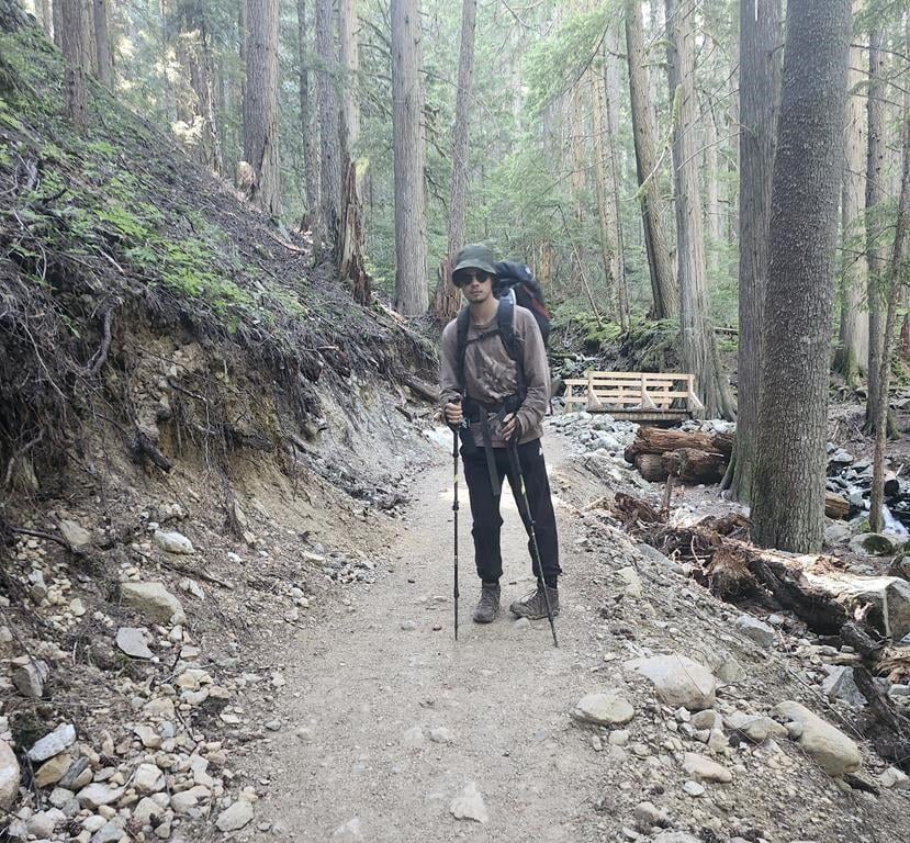 Sam Benastick poses for a photo while hiking