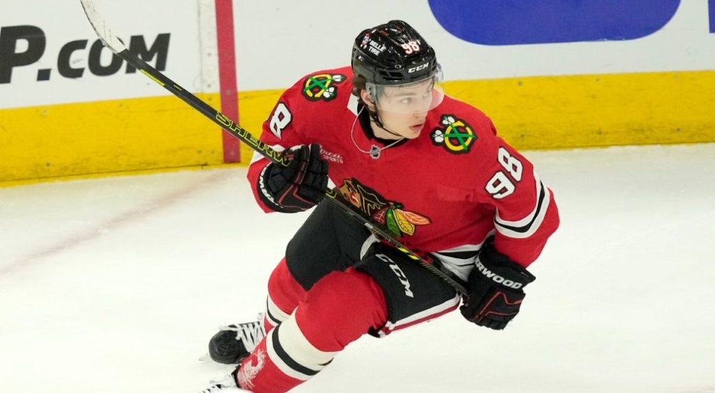 Chicago Blackhawks' Connor Bedard keeps his eyes on the puck during an NHL hockey game against the Minnesota Wild on Friday, Oct. 4, 2024, in Chicago. (Charles Rex Arbogast/AP)