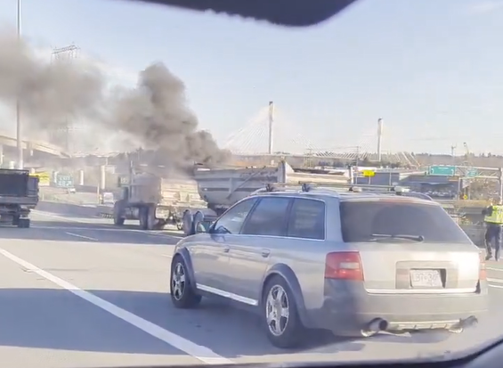 A dump truck on fire on the Port Mann Bridge