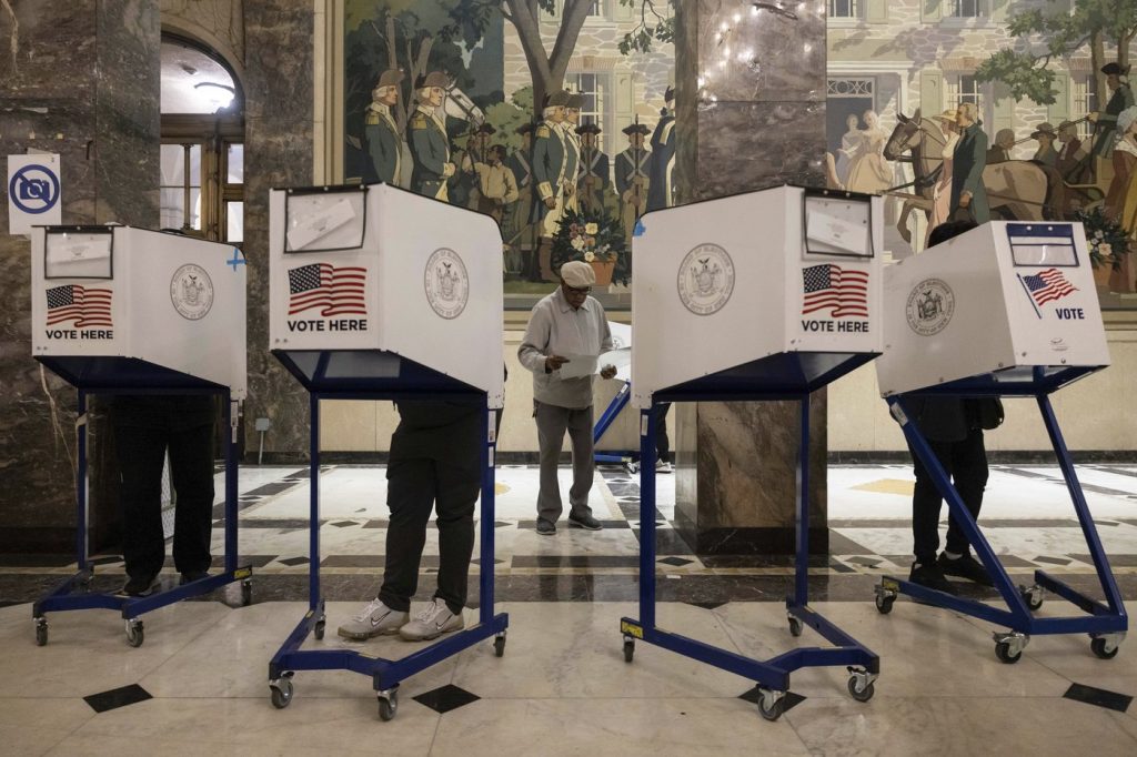 Election Day voting unfolds generally smoothly with some scattered issues and delays