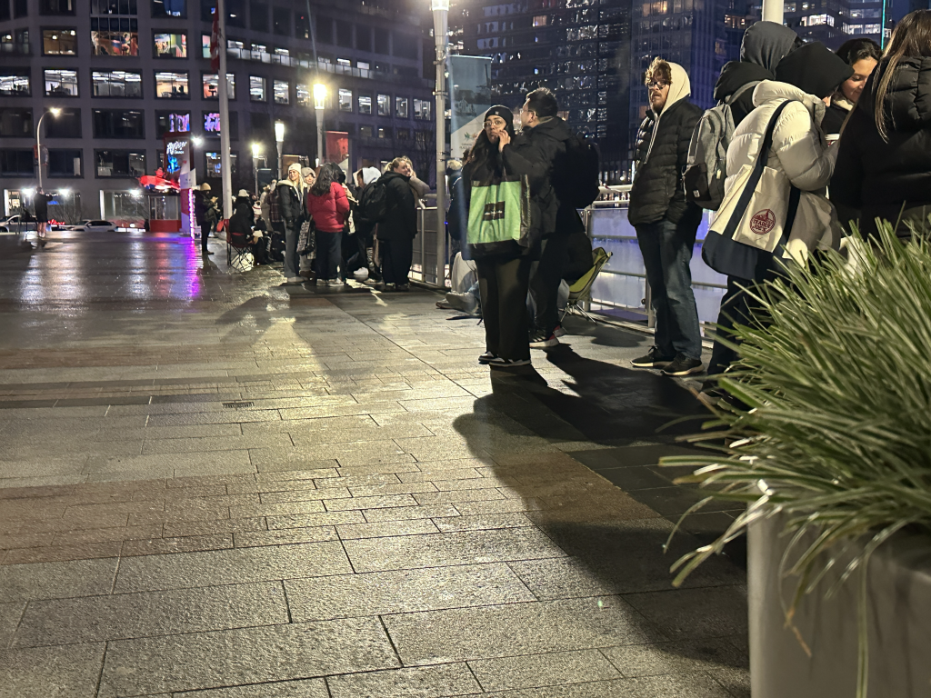 Fans line up at Canada Place waiting to get their hands on Taylor Swift merchandise. (CityNews / Monika Gul)