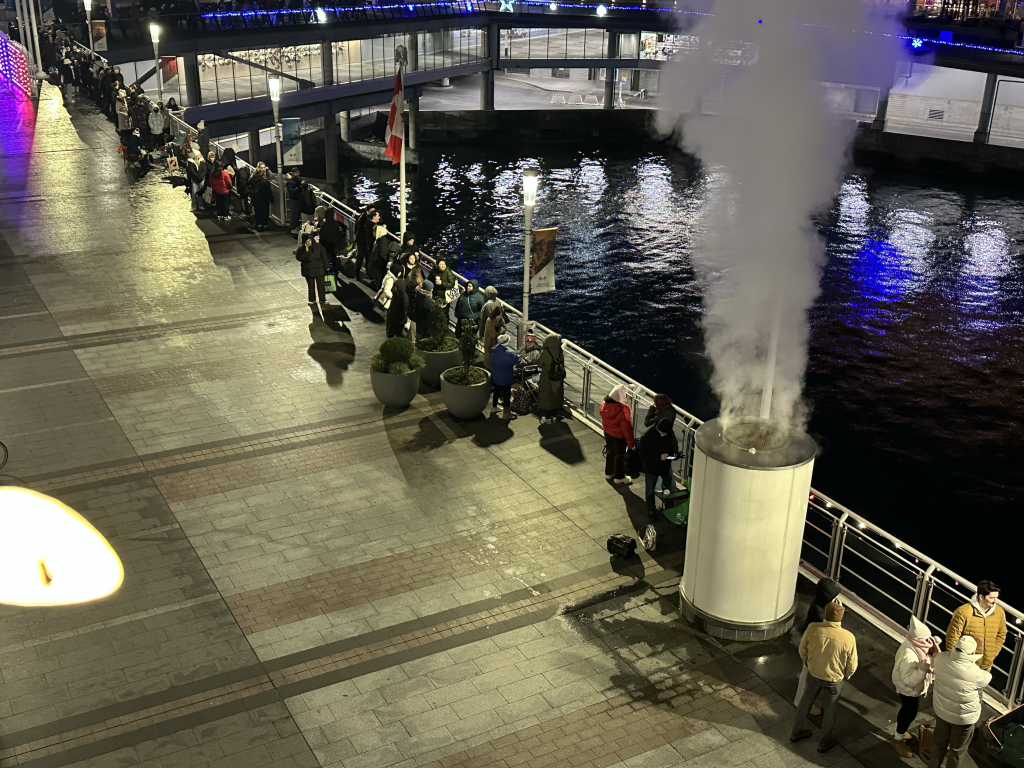 Fans line up at Canada Place waiting to get their hands on Taylor Swift merchandise. (CityNews / Monika Gul)