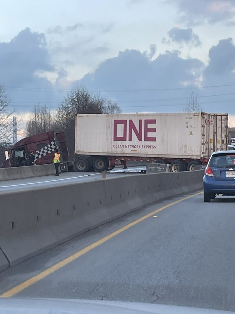 A semi truck blocking lanes of a highway