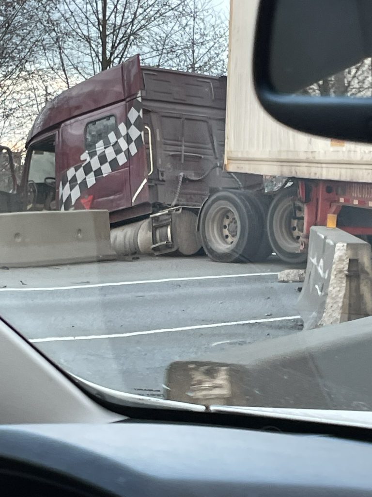 A semi truck blocking lanes of a highway