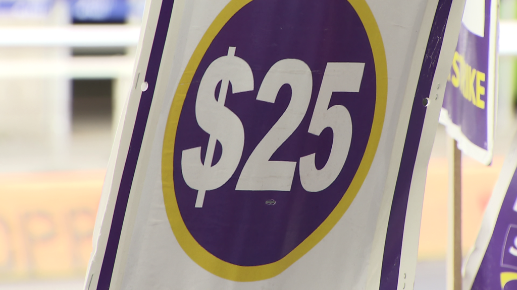 SEIU 2 Local union members demonstrate at Vancouver International Airport in Richmond, B.C. on Monday December 23, 2024.