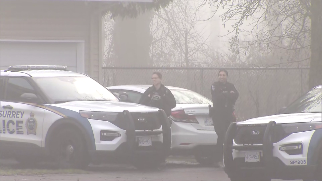 Surrey Police Service members outside a residence where a reported shooting occurred on Monday January 6, 2024.