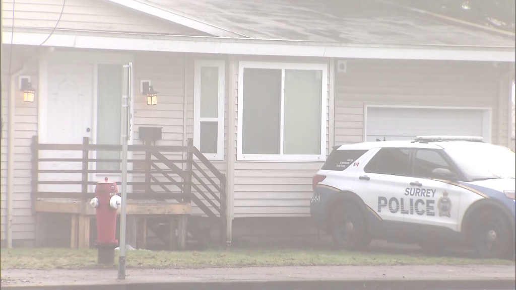 Surrey Police Service members outside a residence where a reported shooting occurred on Monday January 6, 2024.