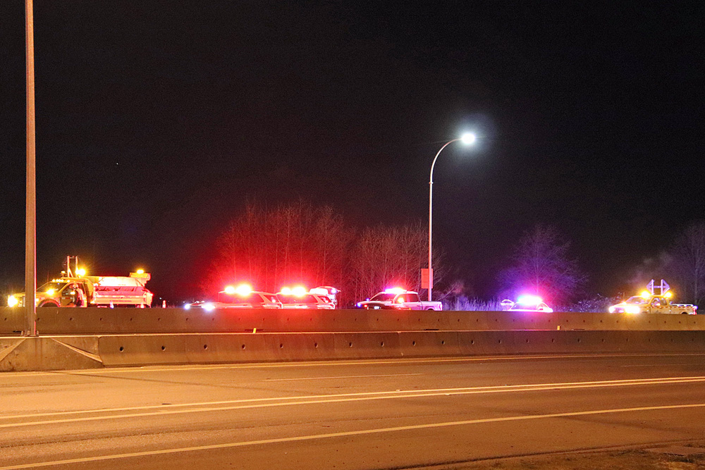 Emergency crews attend a rolled vehicle