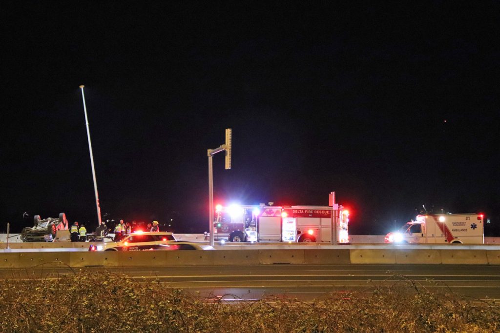 Emergency crews attend a rolled vehicle