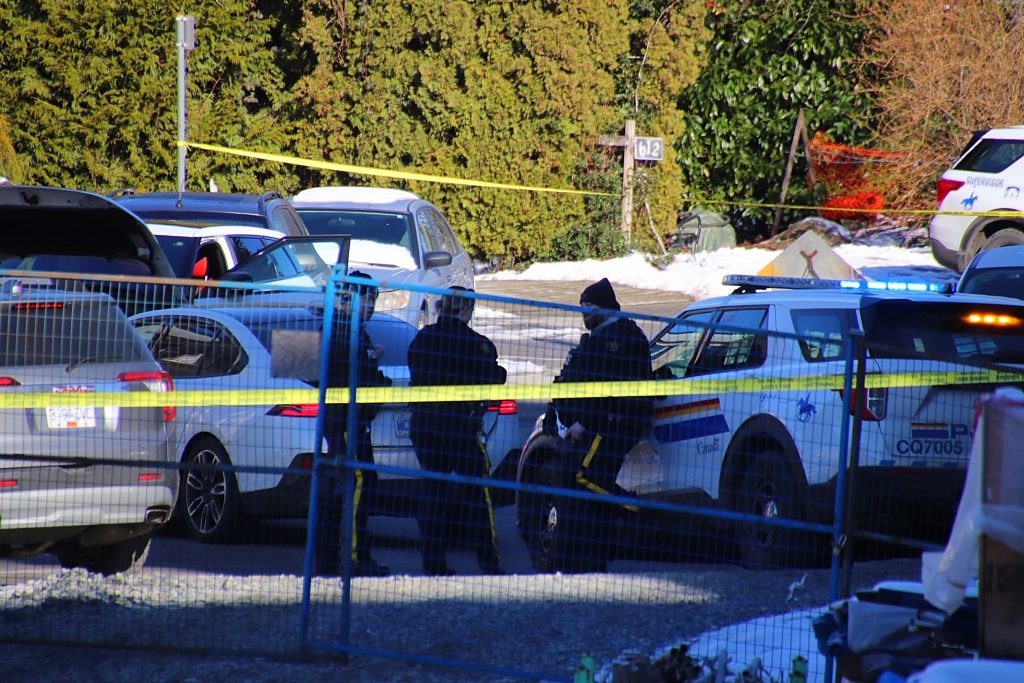 Coquitlam RCMP police tape and vehicles on the scene