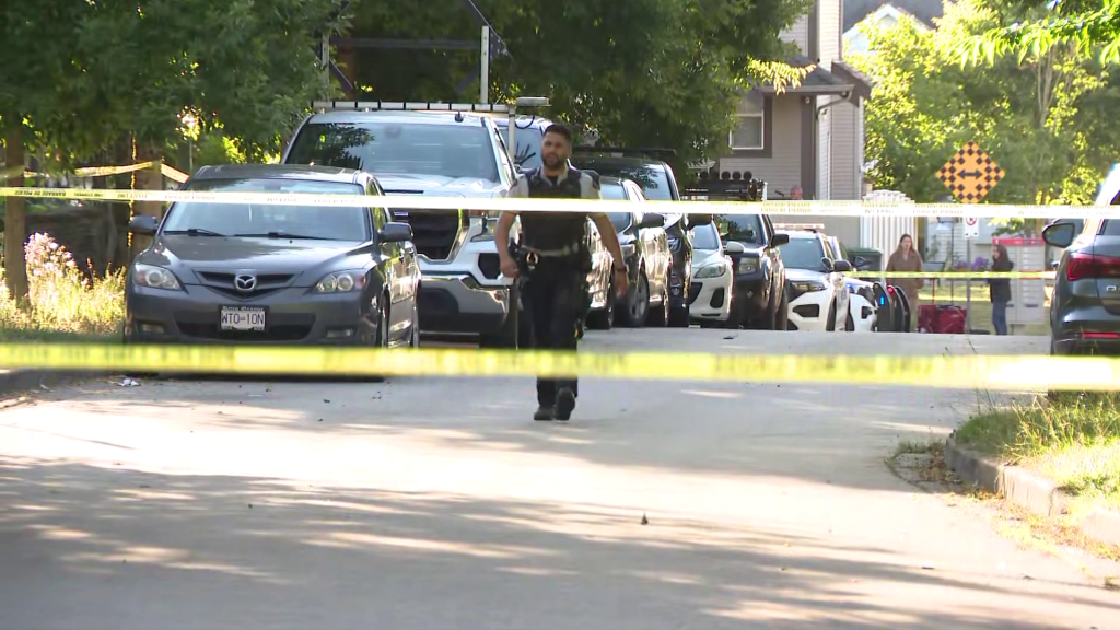Police tape off the scene of a shooting in Surrey