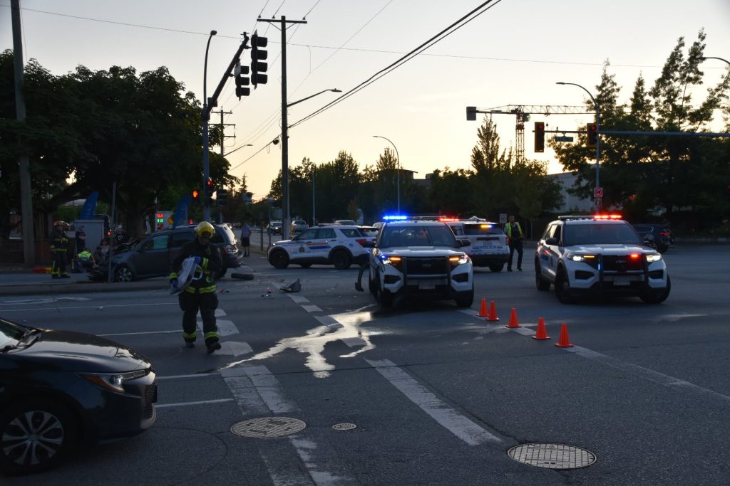 An RCMP cruiser and an SUV collided in Surrey on Sunday night, sending one police officer and three others to hospital. (Credit: Curtis Kreklau)