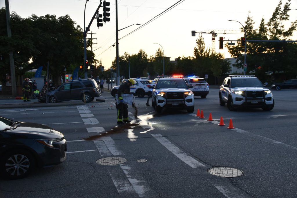 An RCMP cruiser and an SUV collided in Surrey on Sunday night, sending one police officer and three others to hospital. (Credit: Curtis Kreklau)