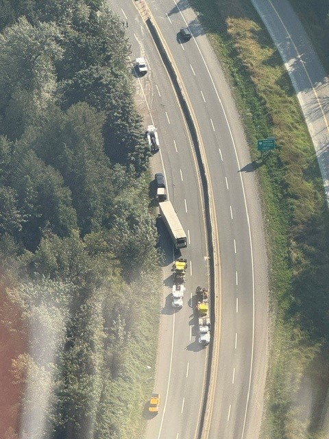 Aerial photo of emergency crews responding to a crashed semi truck