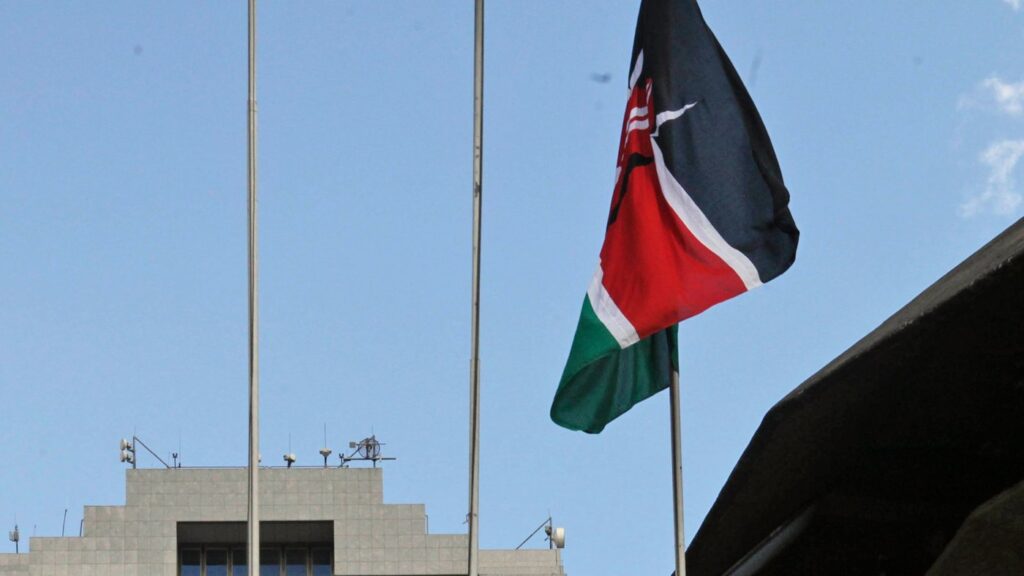 FILE - The Kenyan flag flies at the Kenyatta International Conference Centre during Kenya President Mwai Kibaki's speech inside the building in Nairobi, Kenya, Aug. 5, 2010. (AP Photo/Sayyid Azim, File)