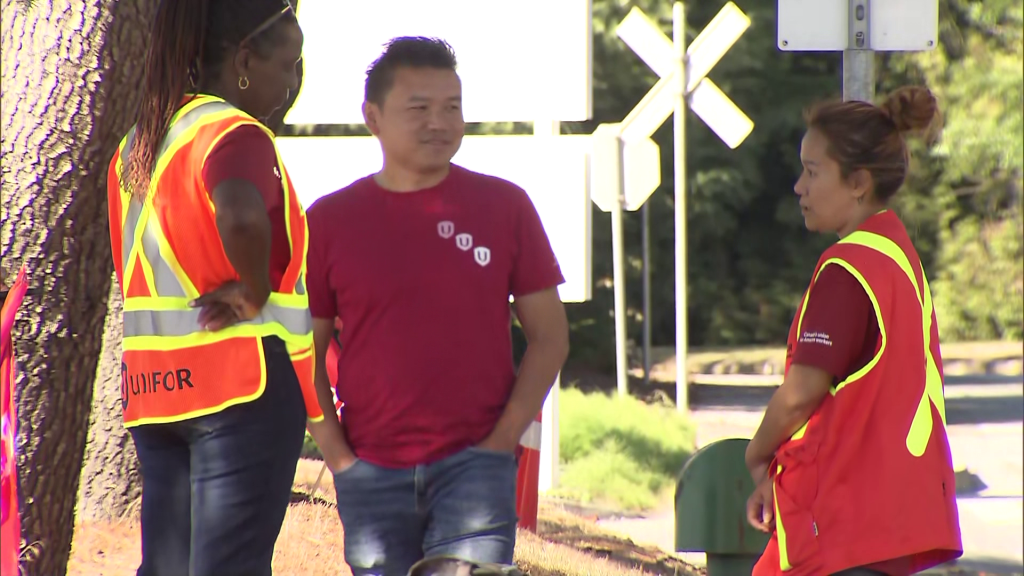 Unifor representatives are seen outside Amazon's fulfilment centre, in Delta, B.C., on Tuesday, September 16, 2025.