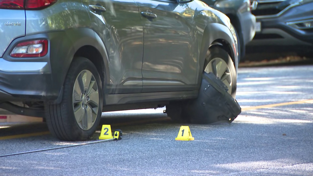 Police markers surround an SUV involved in a crash