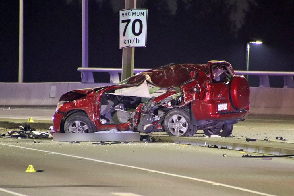 A severely damaged vehicle on Golden Ears Bridge