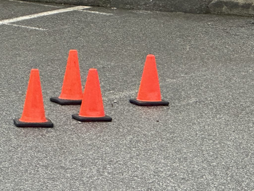 Pylons mark the spot on the ground where bullet casings lie outside a Surrey restaurant