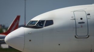 A pilots taxi a Boeing 737-700 aircraft to the runway for departure from Vancouver International Airport, in Richmond, B.C., on Friday, May 19, 2023.