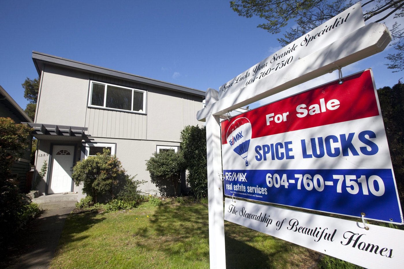 A 'For Sale' sign stands in front of a home in Vancouver on April 8, 2010. THE CANADIAN PRESS/Jonathan Hayward