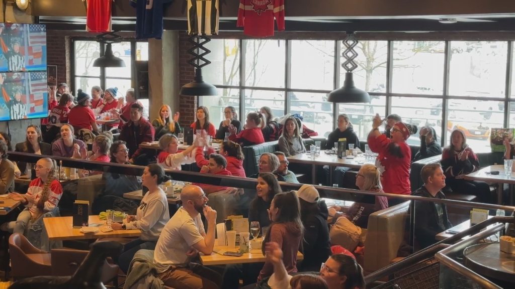 Vancouver hockey fans heartbroken at watch party downtown at the Shark Club after loss against Team USA