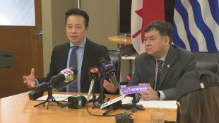 Vancouver Mayor Ken Sim and Councillor Lenny Zhou are seen in a briefing for Chinese-speaking reporters at city hall in Vancouver, on Friday, Feb. 6, 2026.