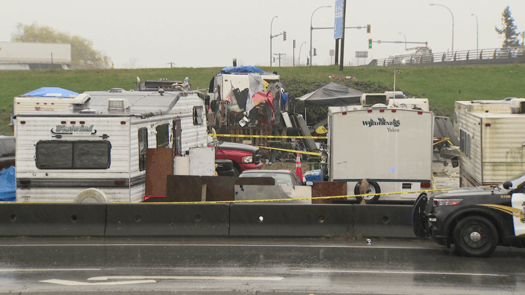 Abbotsford Police investigate a homicide in the park-and-ride lot off Parallel Road near Whatcom Road on Tuesday March 24, 2026.