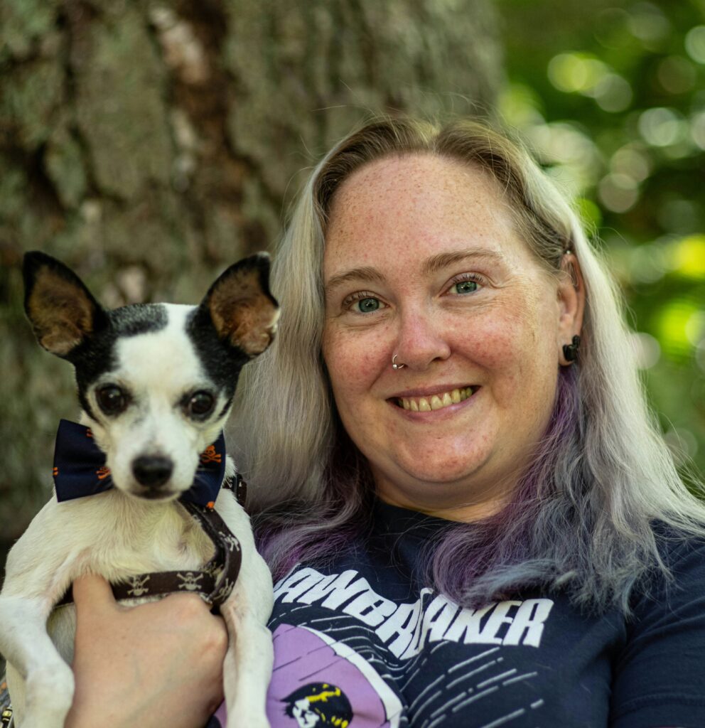 Raynee Novak pictured holding a dog