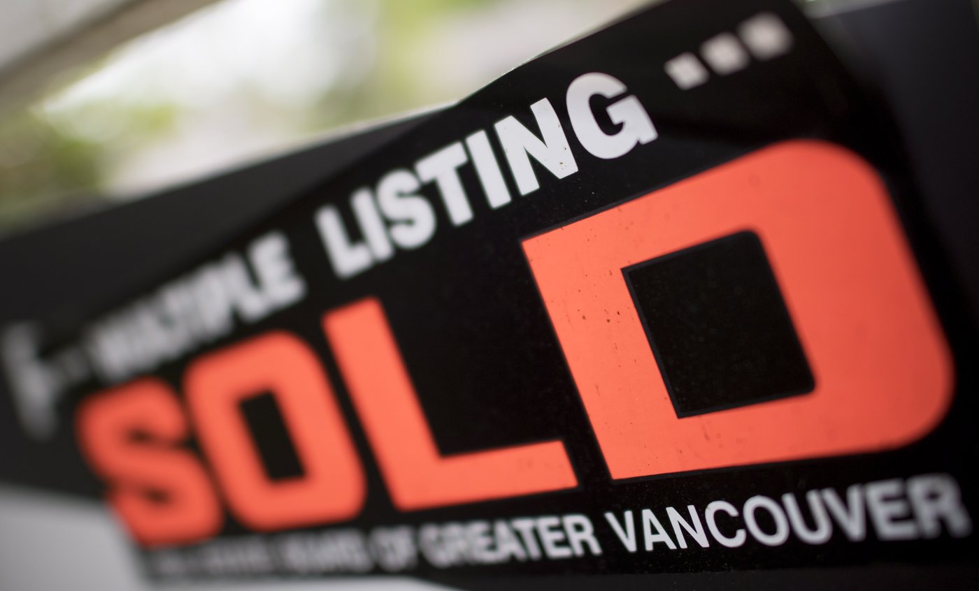 A real estate sign is pictured in Vancouver, B.C., Tuesday, June, 12, 2018. THE CANADIAN PRESS Jonathan Hayward  THE CANADIAN PRESS