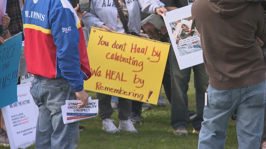 Person holding sign at Day of Togetherness