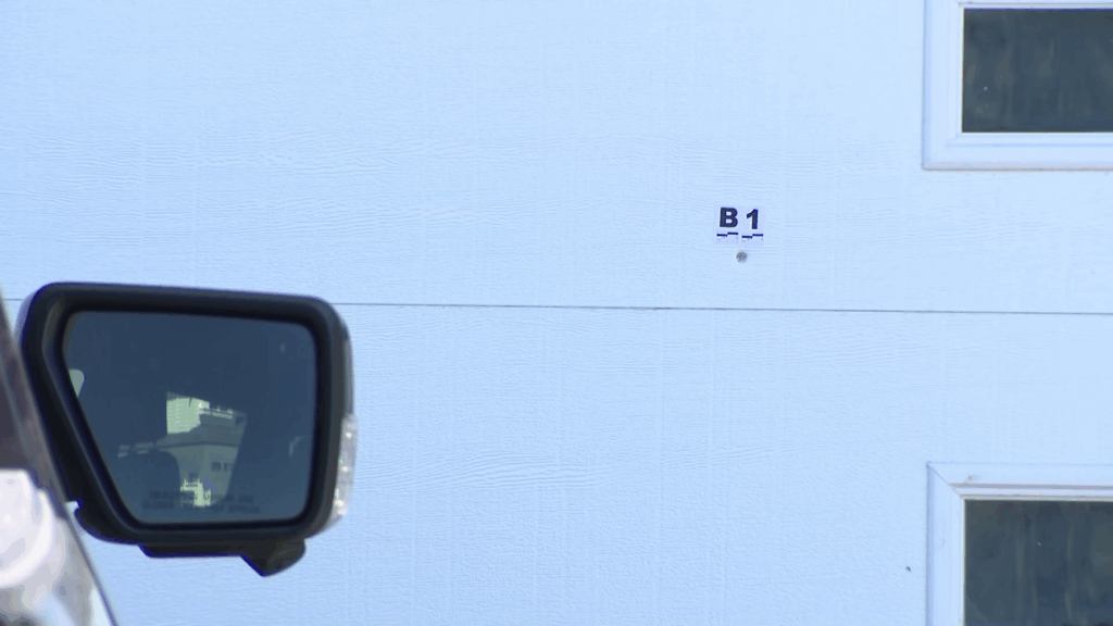 Bullet holes and shattered glass can be seen outside a house that was targeted in Langley on Friday June 12, 2026.