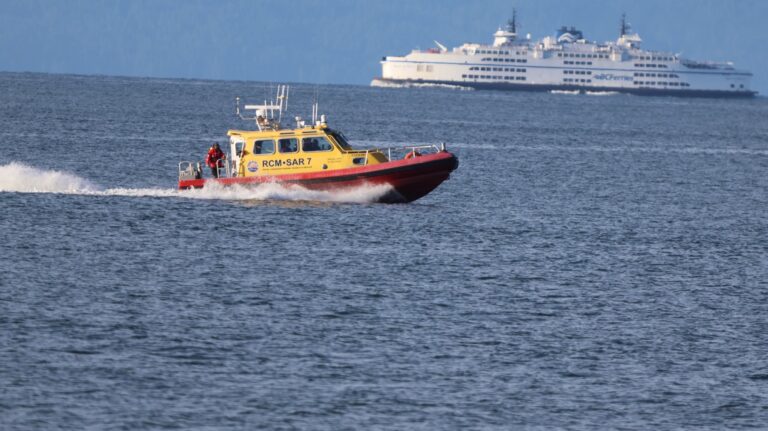 A Royal Canadian Marine Search & Rescue unit from Richmond alongside a BC Ferries vessel search in the waters of the Strait of Georgia on Sunday June 28, 2026. (@RCMSAR10 / X Image)