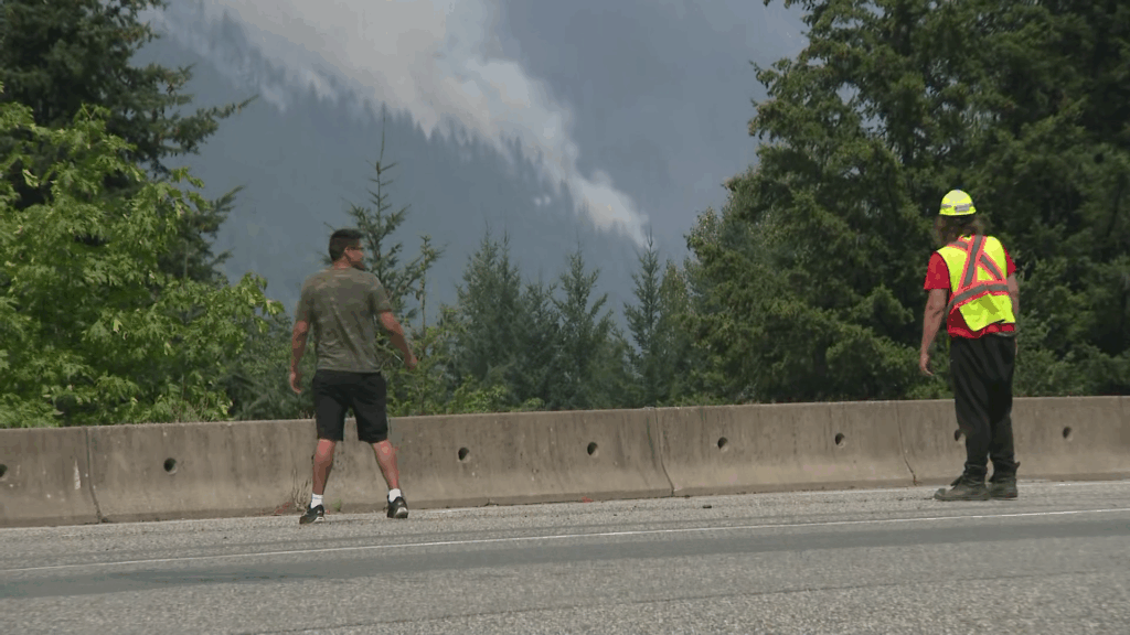 Wildfires are seen near Boston Bar, B.C. as Highway 1 closes on Thursday July 16, 2026.
