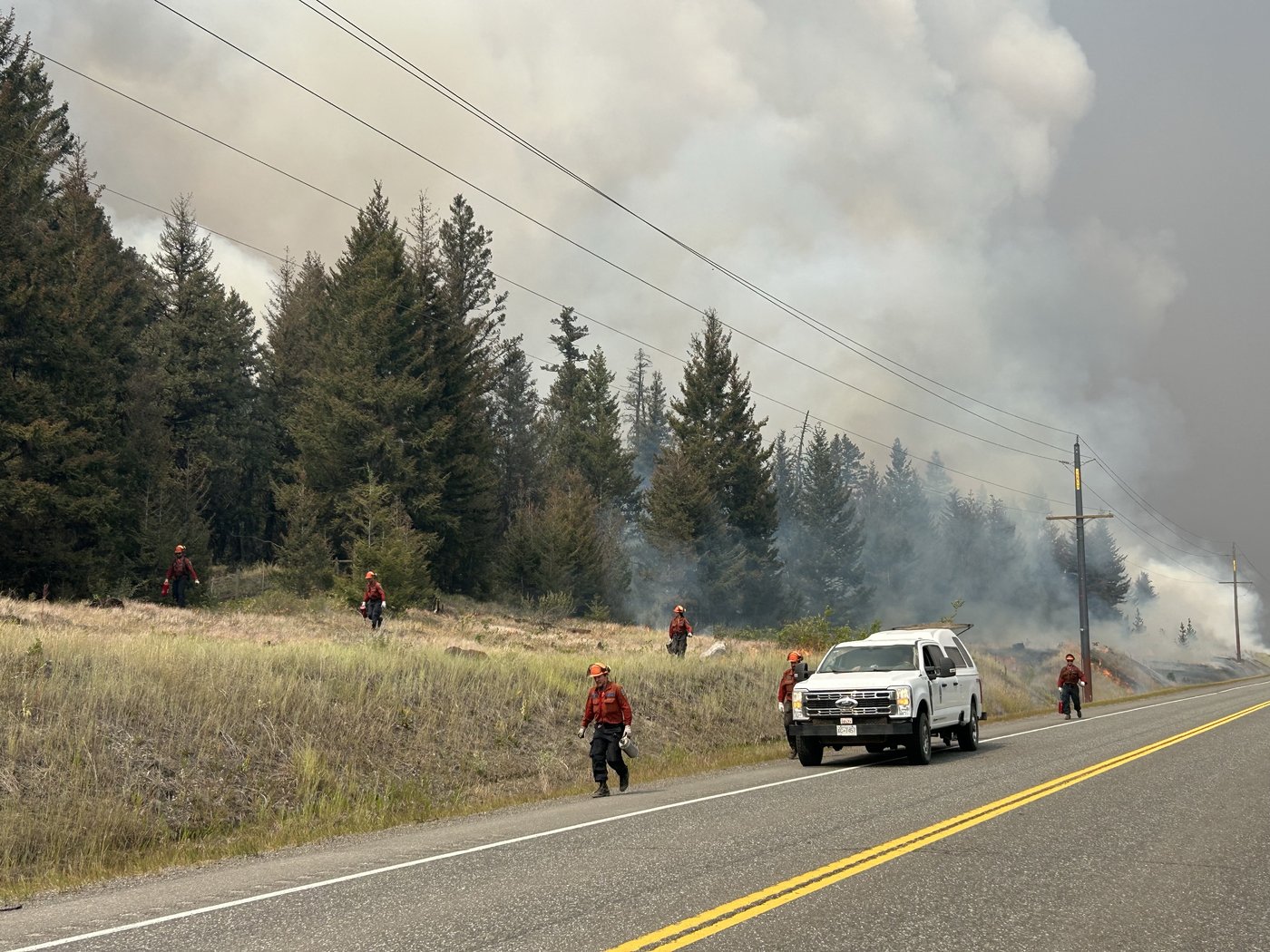 Rescue crews work on a planned arson for the “Pear Lake” fire near Cariboo in British Columbia on Wednesday, July 29, 2026, in this photo provided as a handout. THE CANADIAN PRESS/Handout, B.C. Wildfire Service (mandatory credit) BC Wildfire Service